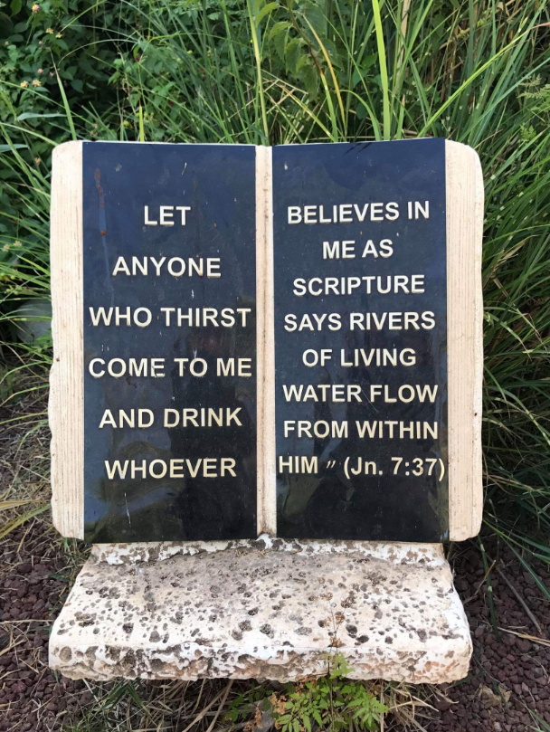 Scripture lines the path to the Mount of Beatitudes